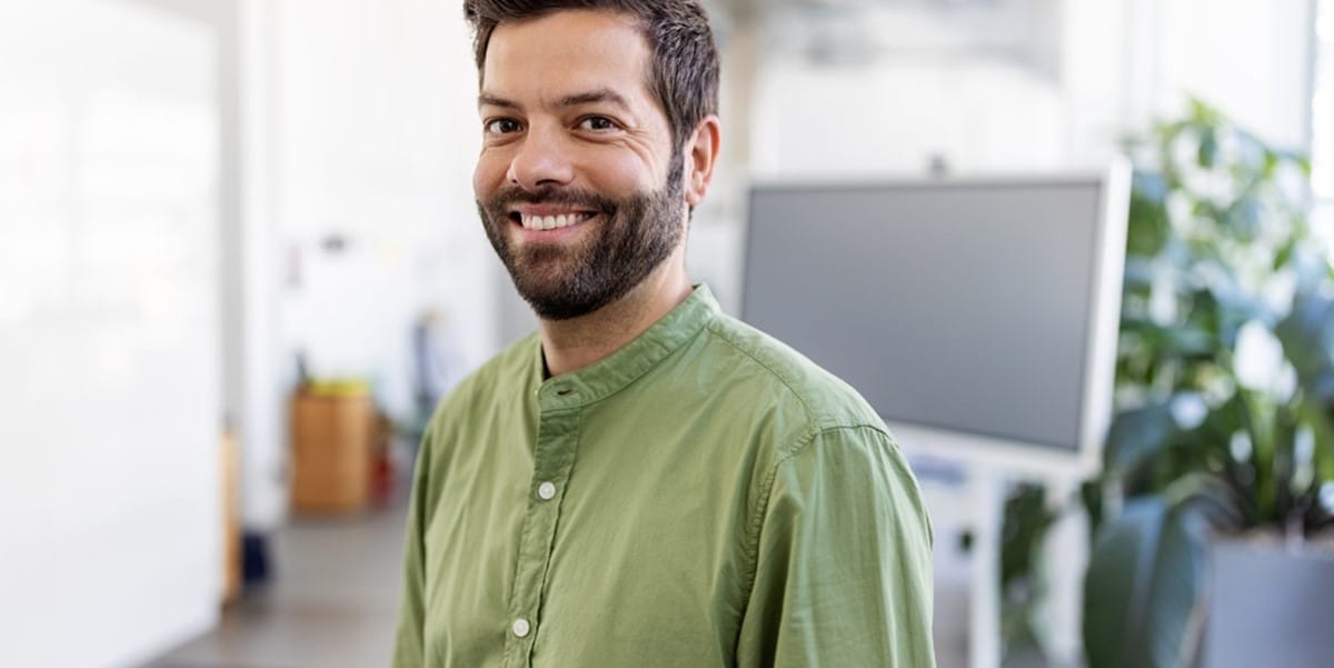 man smiling in office